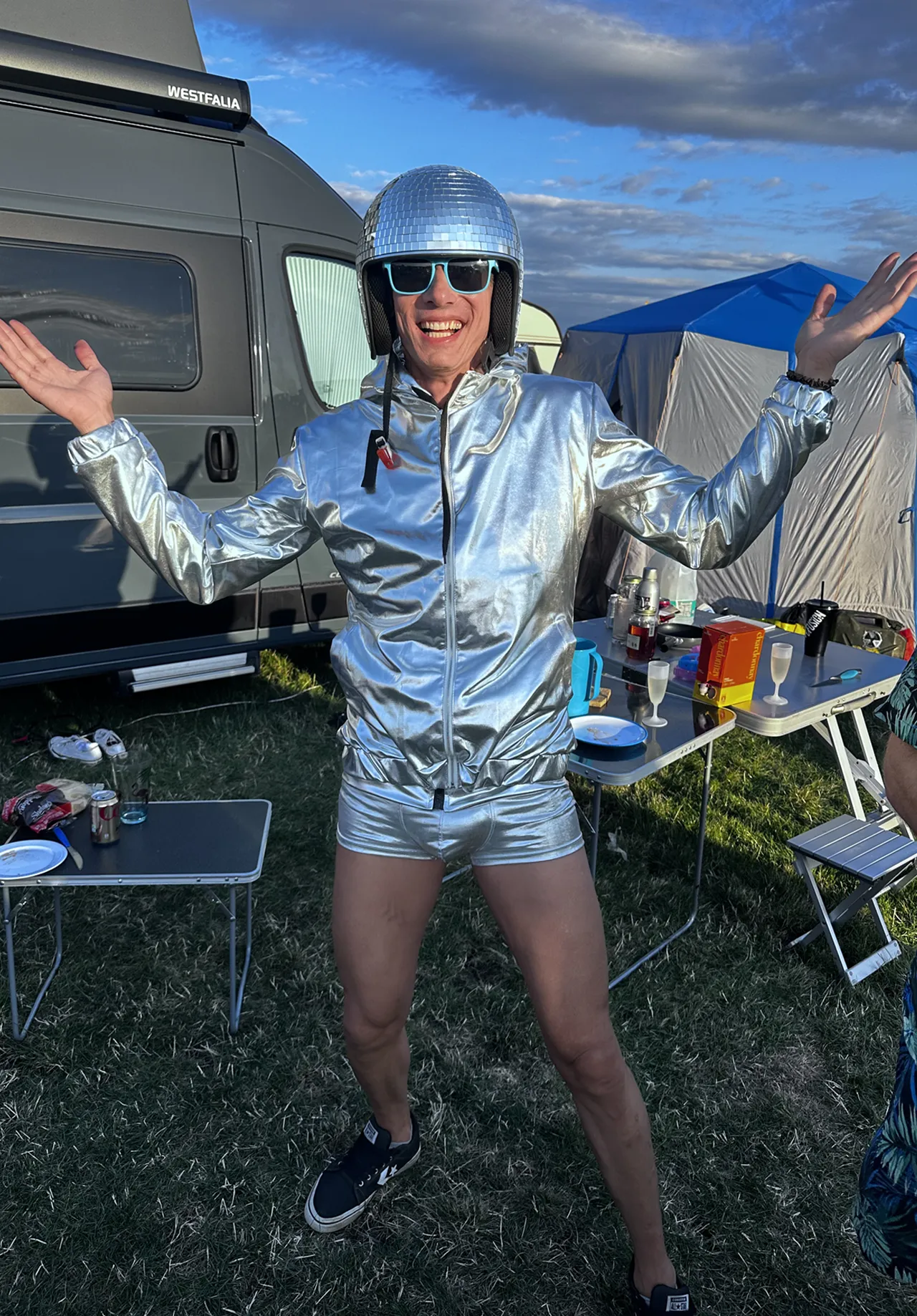 A man in a silver suit dressed for the Saturday night theme