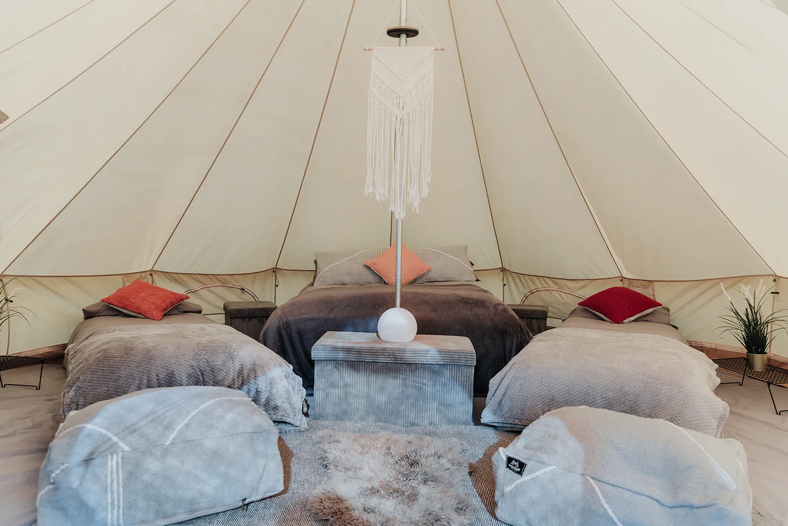 The Beau glamping package, bell tent interior with made-up beds.